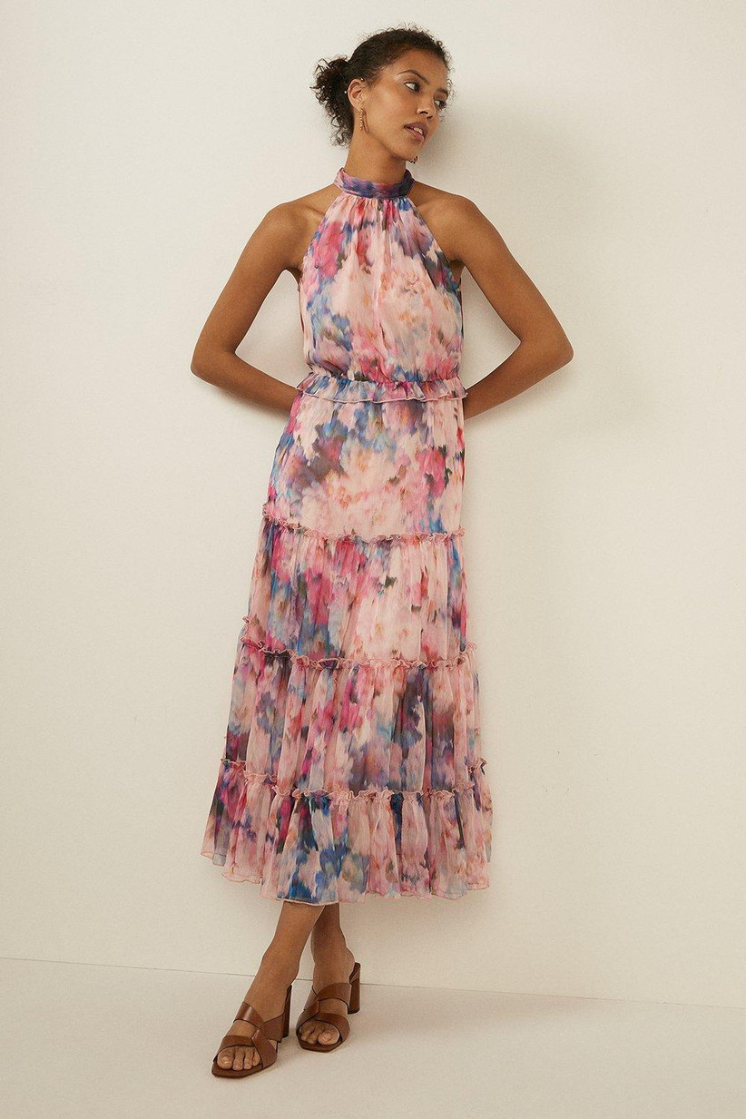 Girl wearing a floral halter neck midi dress