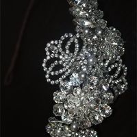 Amanda Wyatt "Olga" wedding dress and Jo Barnes "Grace" side head band