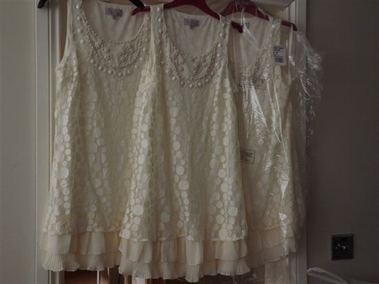 3 bridesmaids dresses and 3 pairs of gold pumps