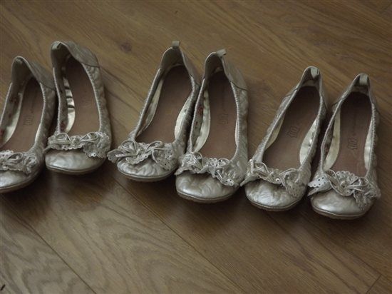 3 bridesmaids dresses and 3 pairs of gold pumps