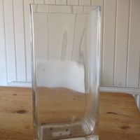 12 clear vases, 6 white table name holders, 8 vintage bucket tealight holders for sale