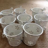 12 clear vases, 6 white table name holders, 8 vintage bucket tealight holders for sale