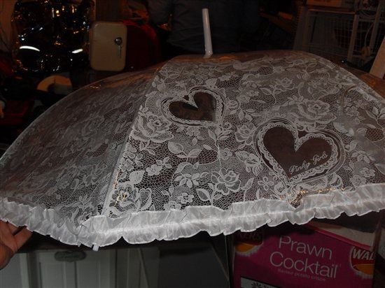 White plastic lace effect umbrella