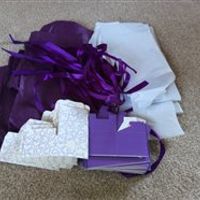 Cadbury purple wedding bits: table runners, favour boxes, wooden hearts, small bouquet, posy, ribbon