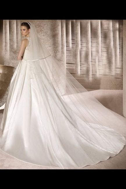 Help? Does anyone know who this wedding dress is by and the name of it? 