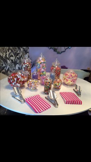 Pastel ribbon and lace chair decorations, paper lanterns and other lovely wedding bits