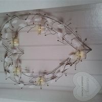 Next cream and pearl tea light wall holders.