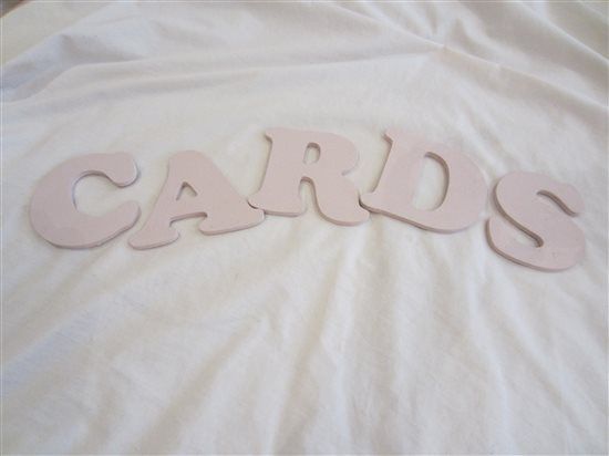 Pale pink wooden 'CARDS' letters