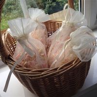 Re: Flip flop basket, hurricane vases, vintage mirror ory and pink delphinium confetti with whicker 