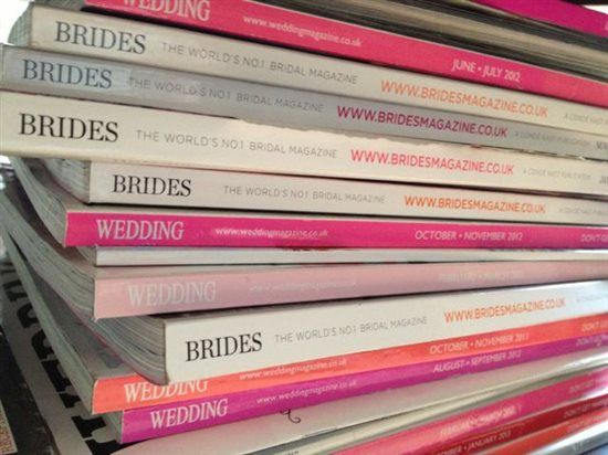 21 wedding magazines and Just Married wooden signs