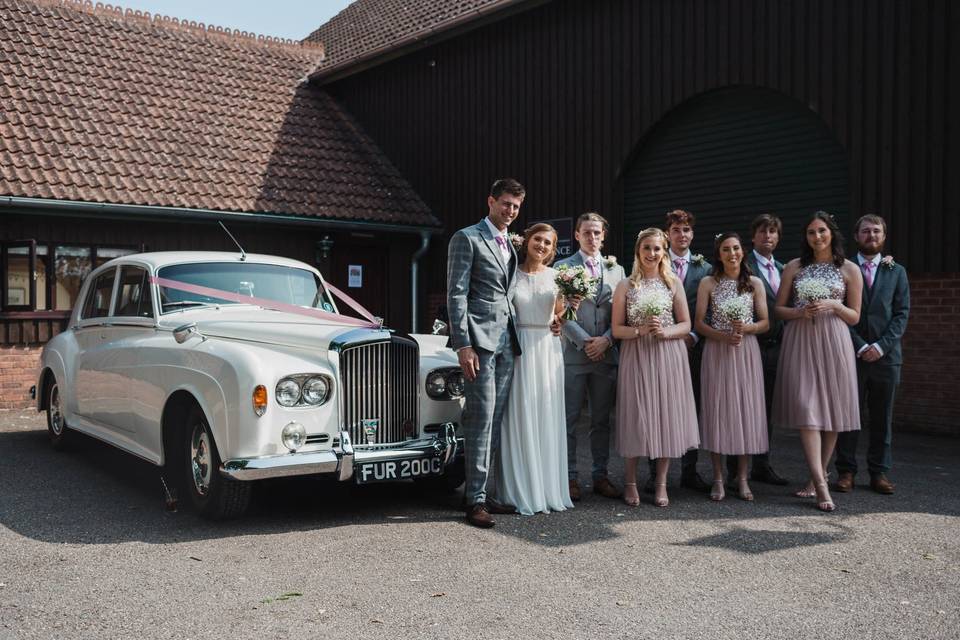 Wedding party and car