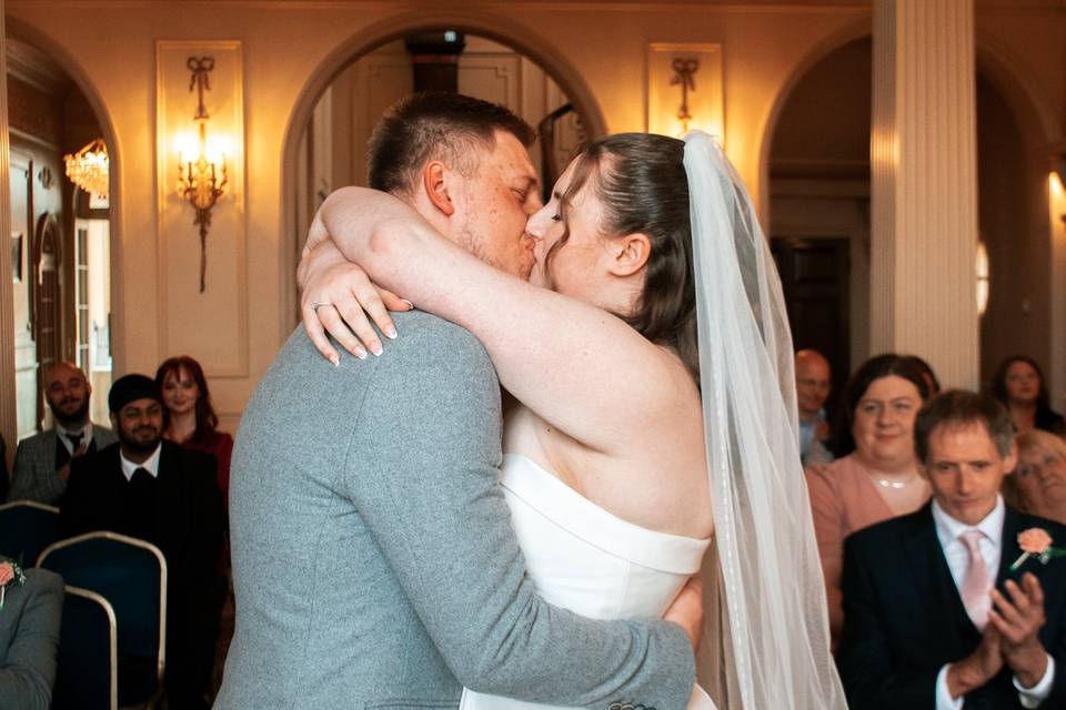 Abbey and Nathan kiss at ceremony