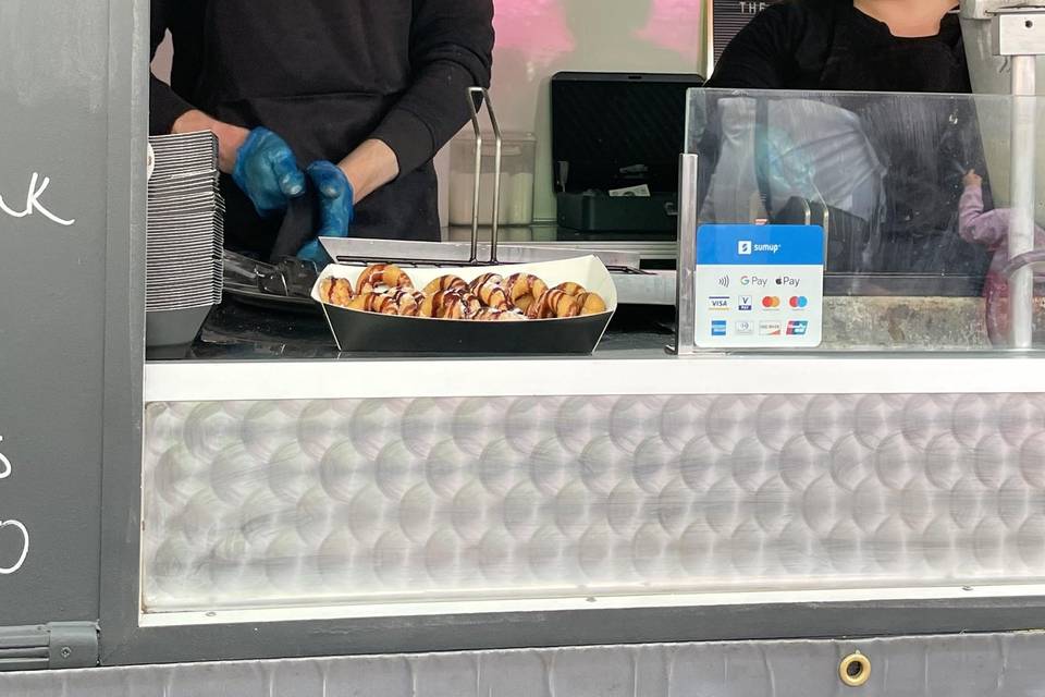 Owners serving donuts