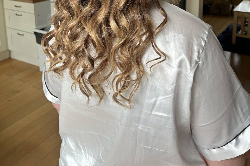 Half up half down curly hairdo