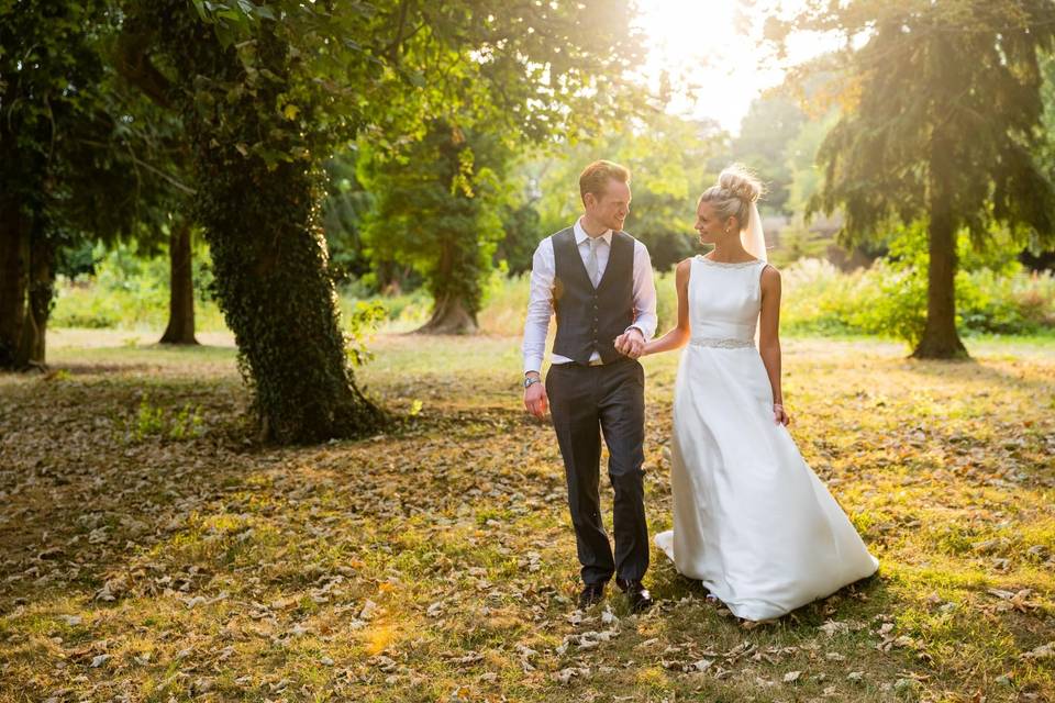 Pair walking and holding hands - Laura Ellen Photography