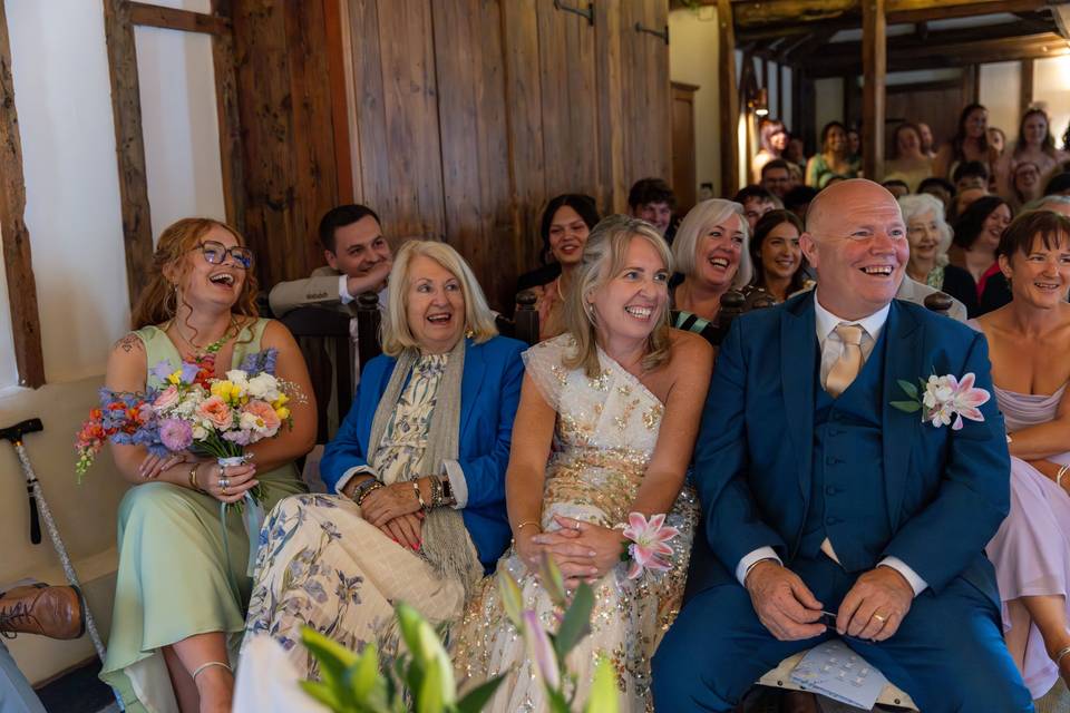 The family and friends laugh