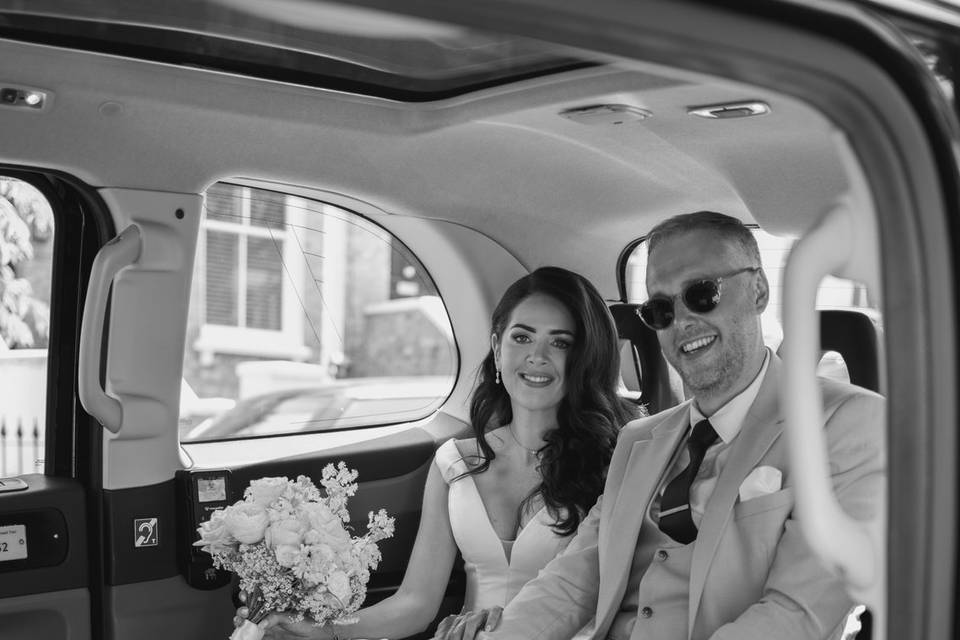 Black cab bride and groom