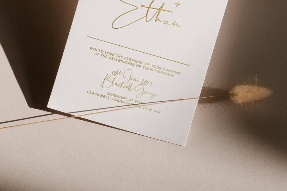 Gold and white wedding invitations