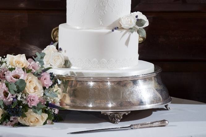 Ivory lace wedding cake and sugar flowers