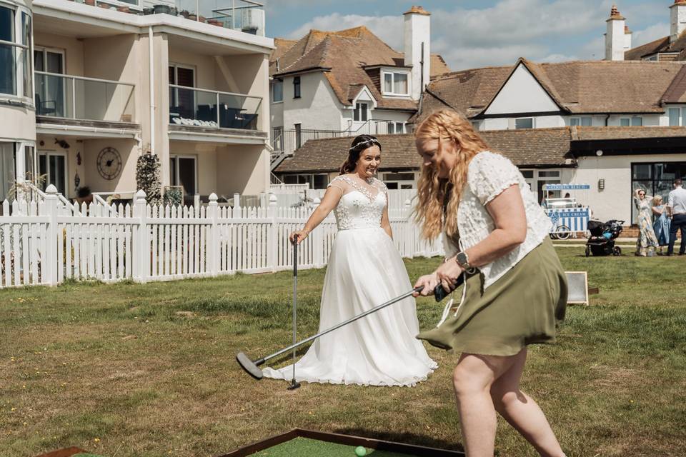 Bride playing mini golf