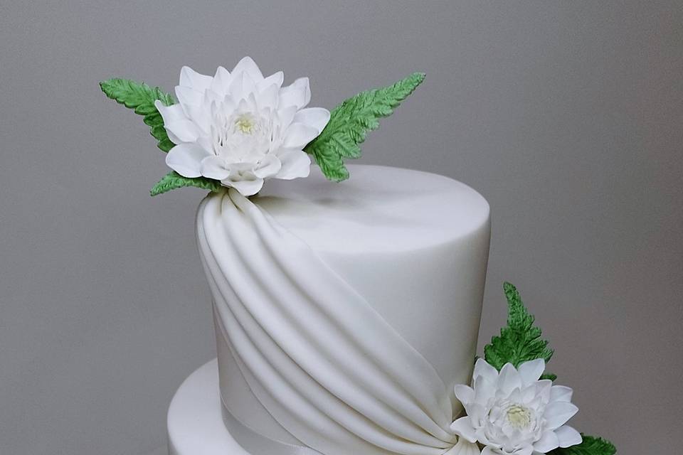 White cake with sugar flowers