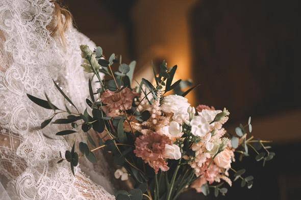 Bride holding wild bouquet