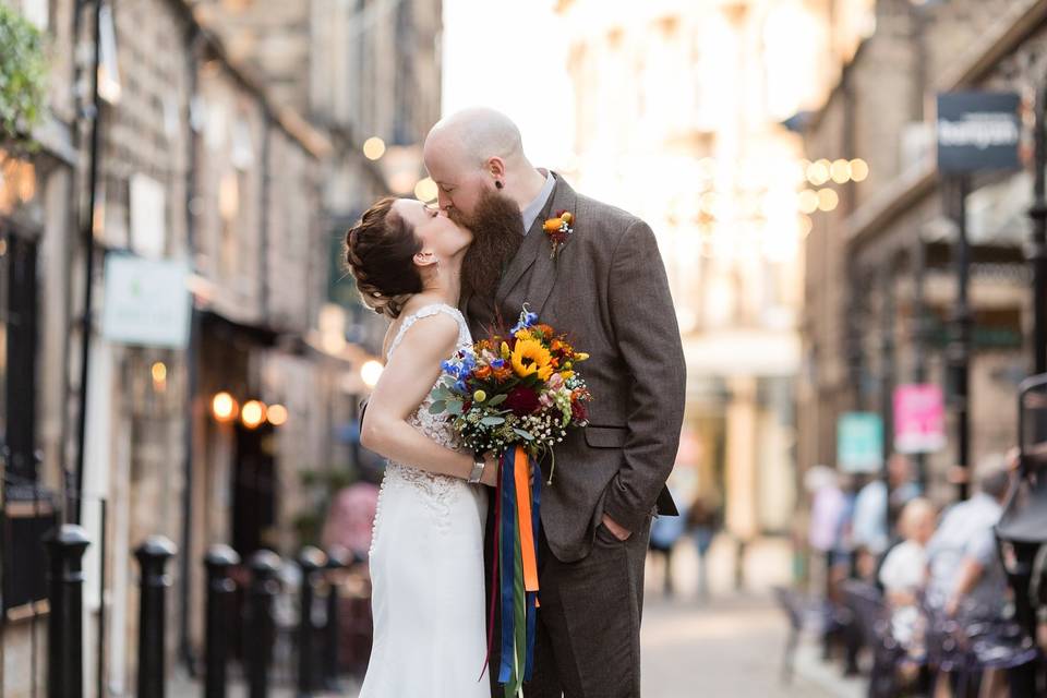 Wedding couple kiss in street