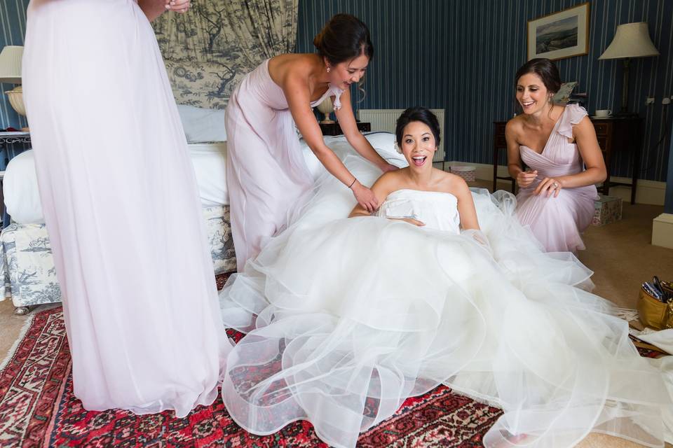 Bride laughing on the floor