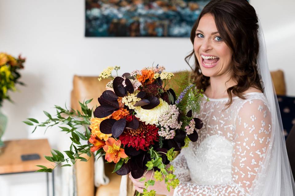 Bride smiles with floers