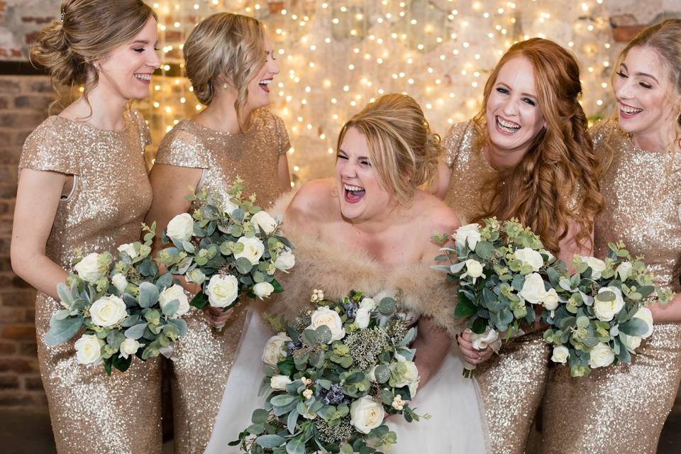 Bride & bridesmaids laugh