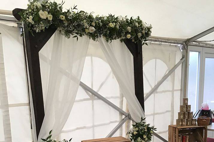 Rustic arch with white voile