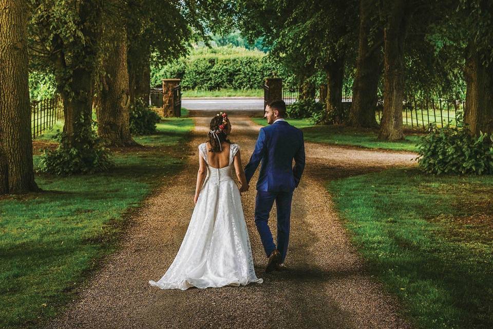 Bride and groom driveway walk