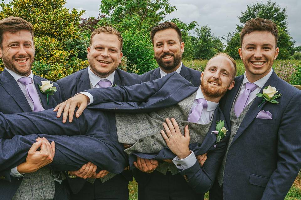 Groomsmen smiling with groom