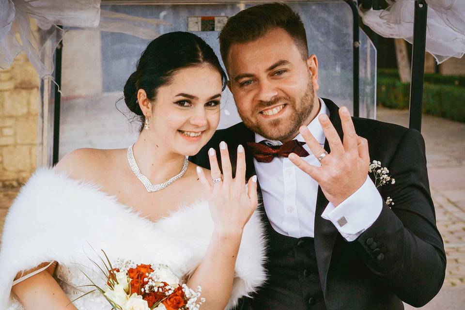 Bride and groom show off rings