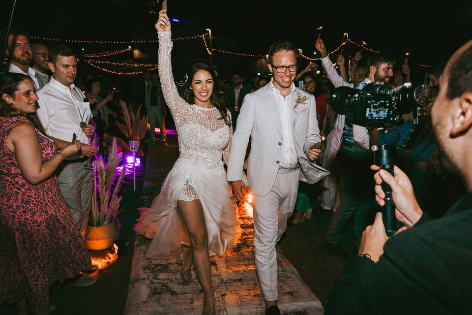 Bride and groom beach walk