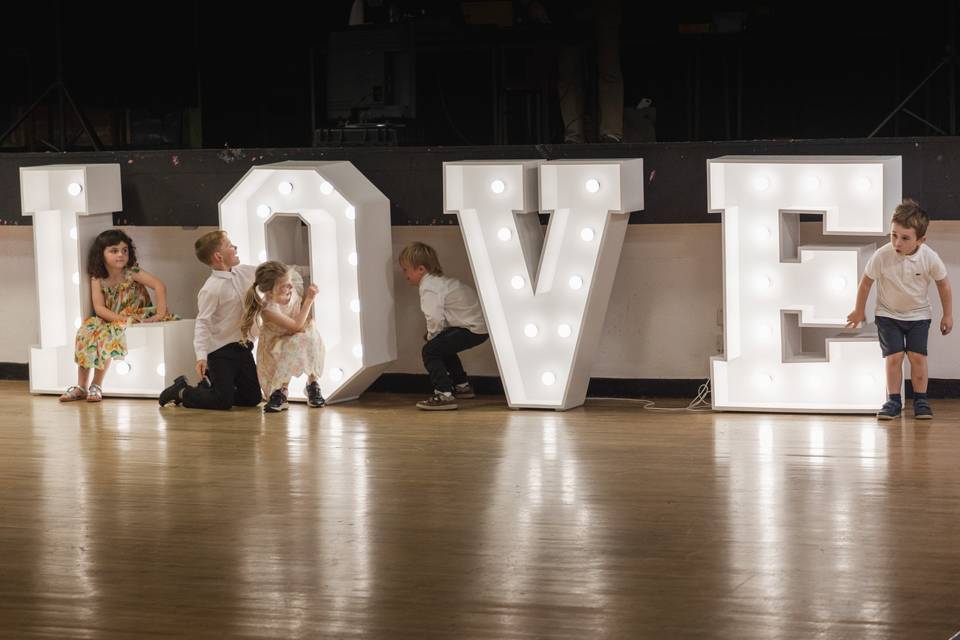 Kids playing on the letters