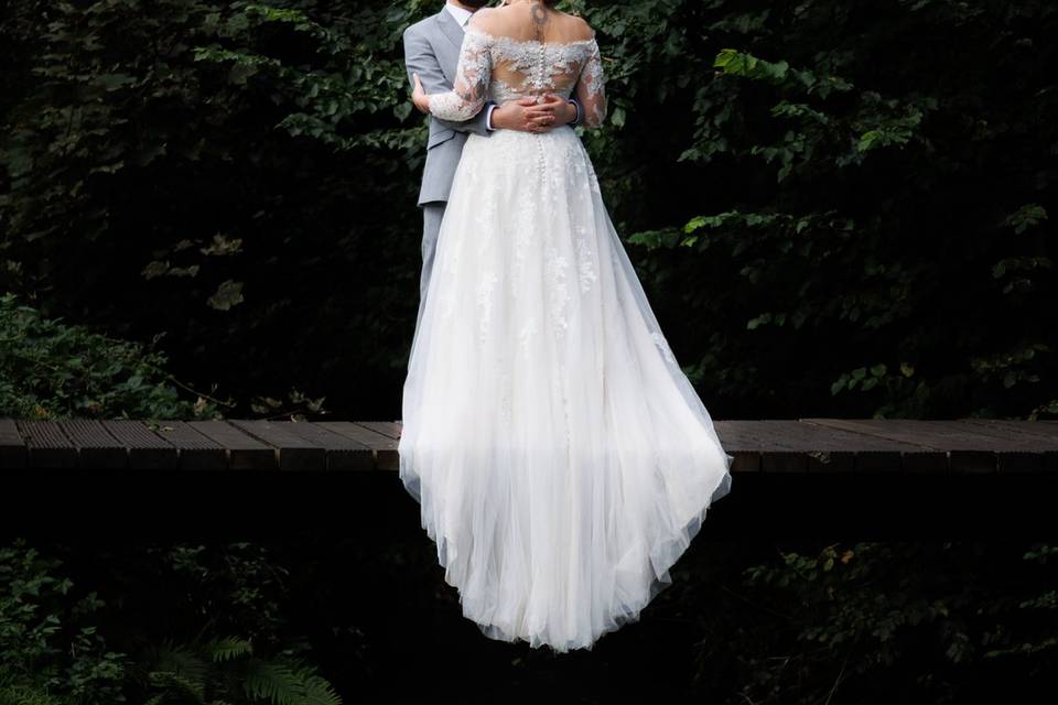 Bride and groom on bridge