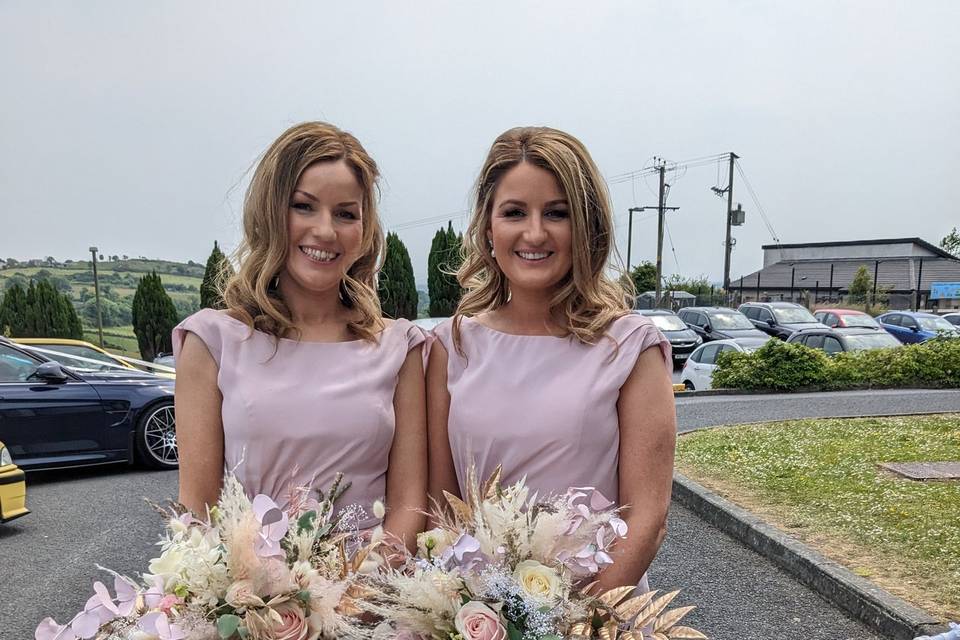 Holding bouquets and smiling