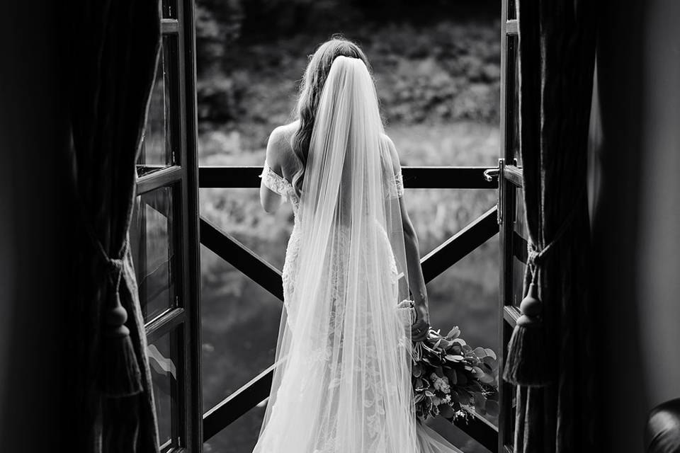 Bride at boathouse
