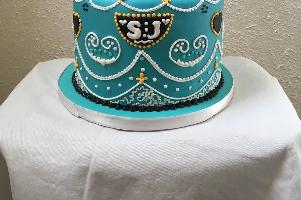 Ornate icing with lace and bead decor