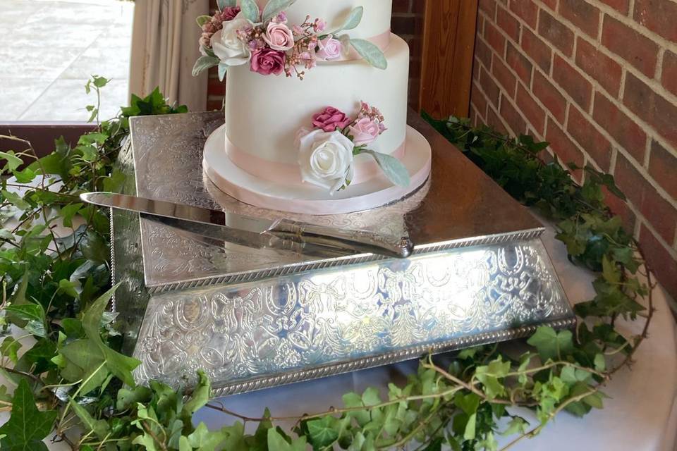 Three-tier pastel flower cake