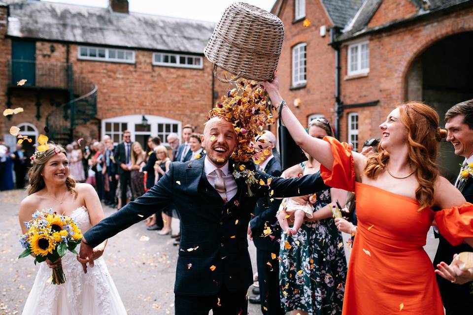 Groom getting confetti dumped