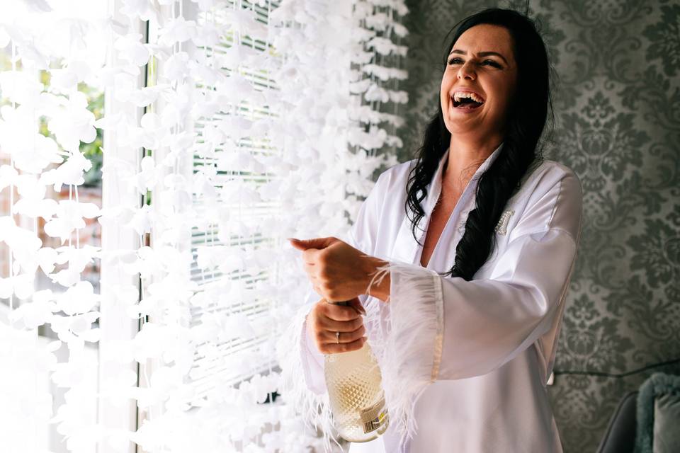 Bride popping the cork