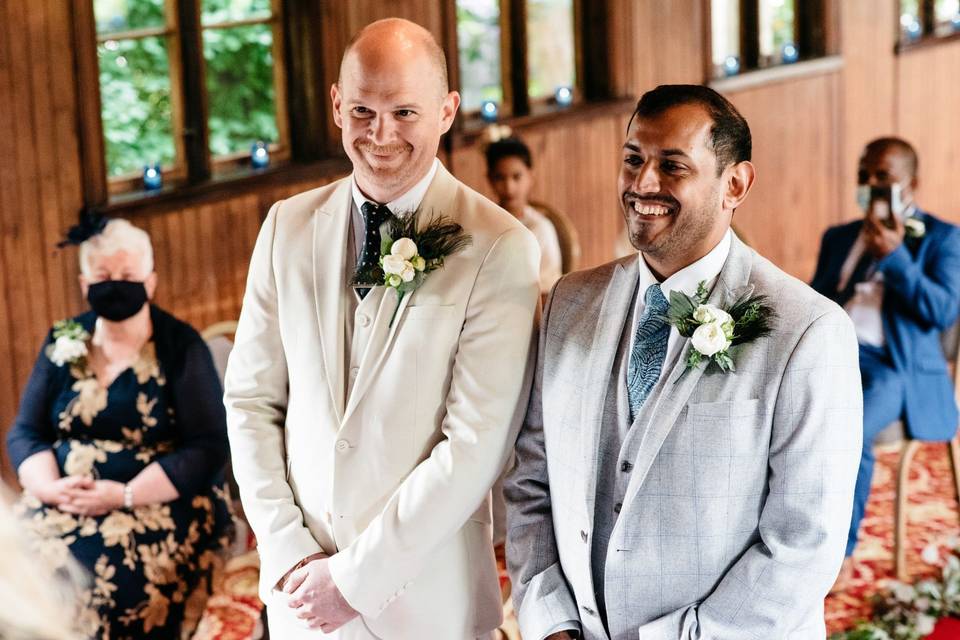 Happy grooms getting married