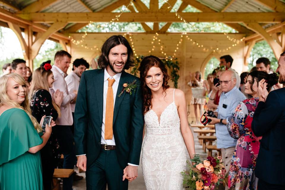 Newlyweds leaving the ceremony