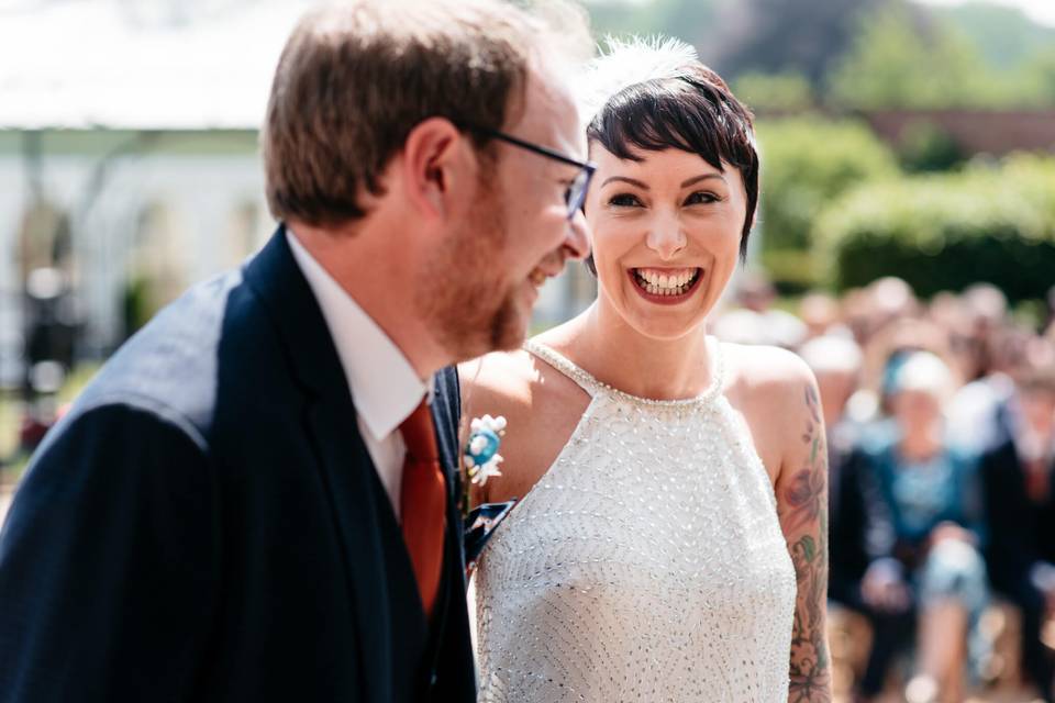 Bride smiling at groom