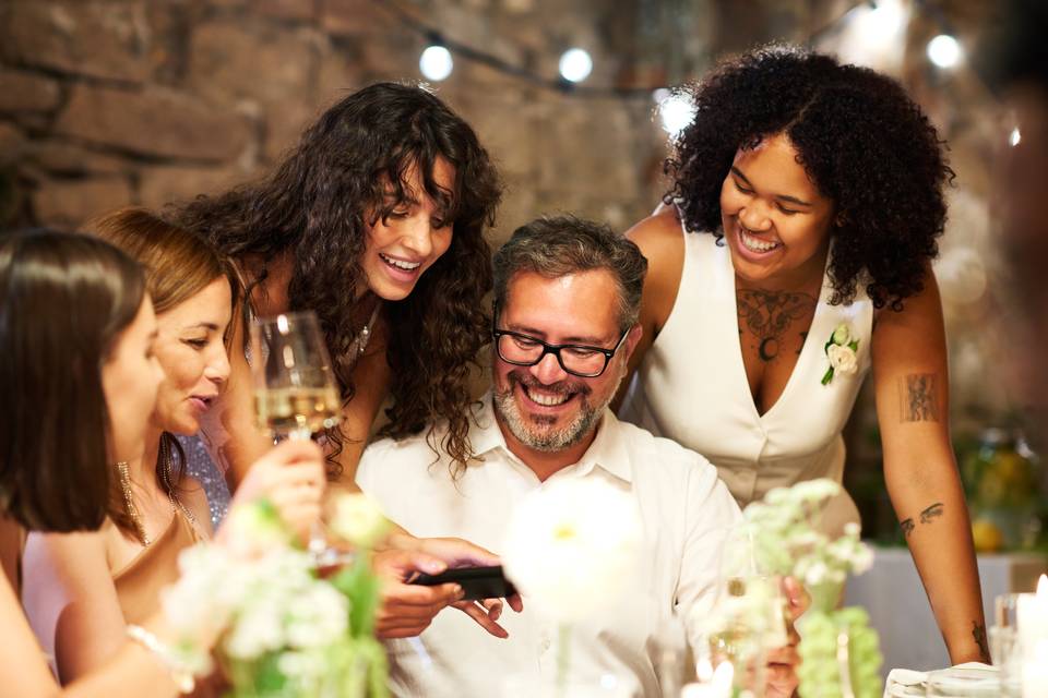 Family at dinner sharing photo