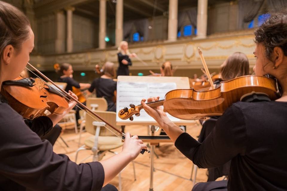 A concert orchestra rehearsing