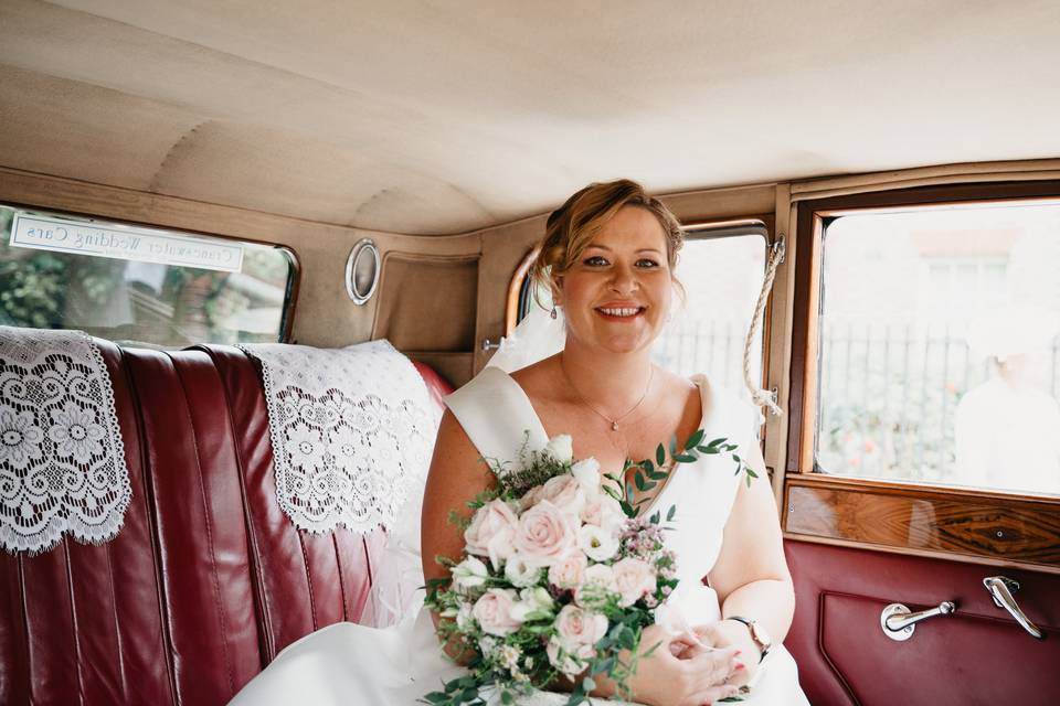 Bride in the vintage Rolls-Royce