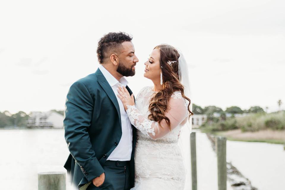 Waterside. bride and groom
